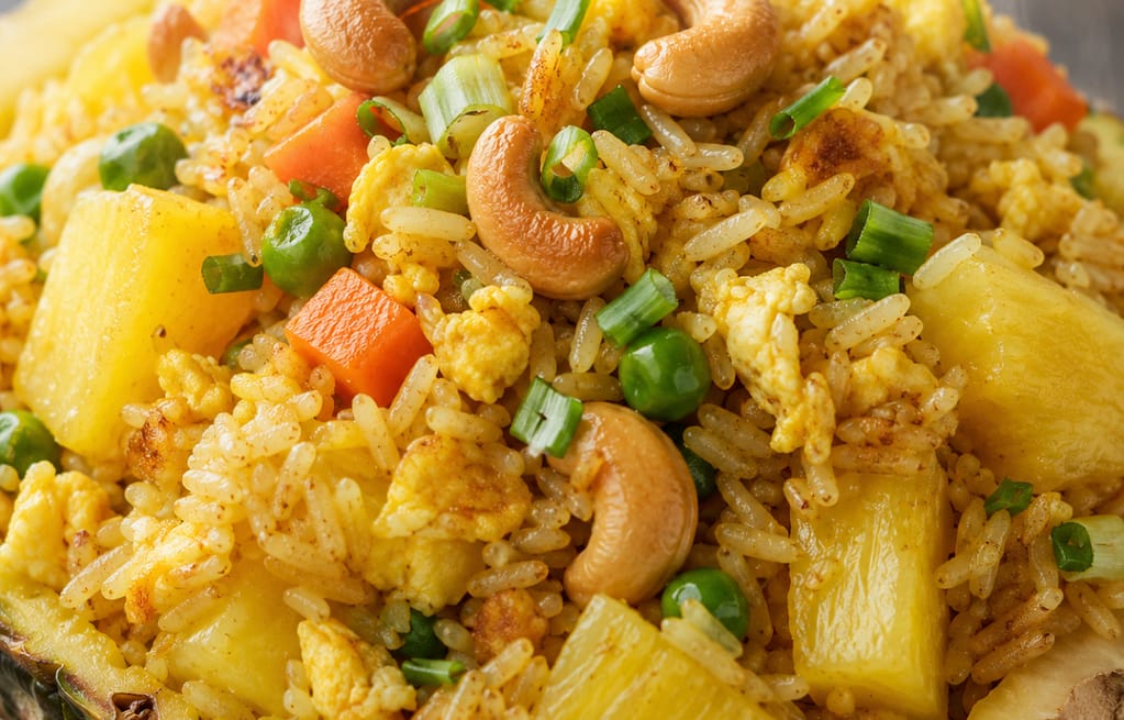Authentic Thai pineapple fried rice in NYC with fresh pineapple and cashews