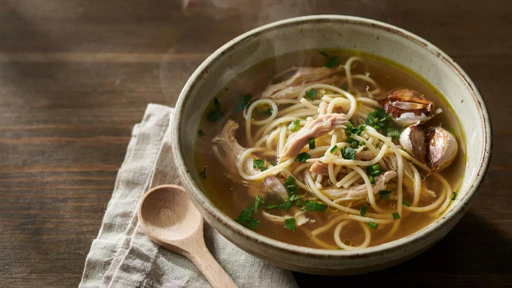 Fresh garlic chicken noodle soup prepared daily at Zoobzibthai NYC