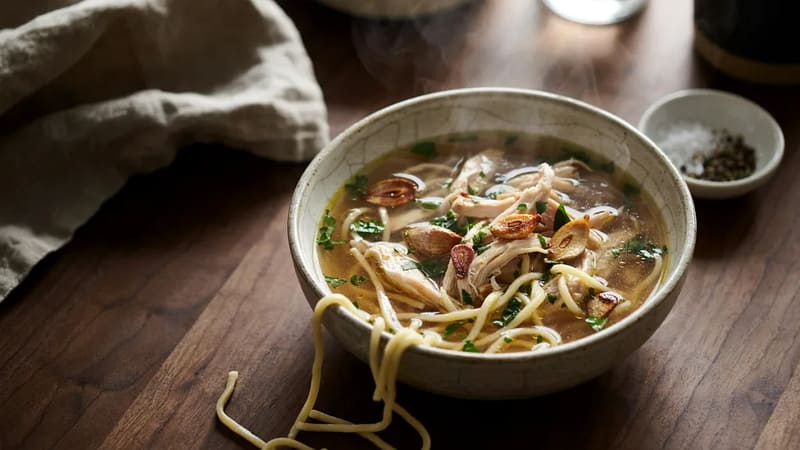 Garlic chicken noodle soup served fresh at Zoobzibthai NYC