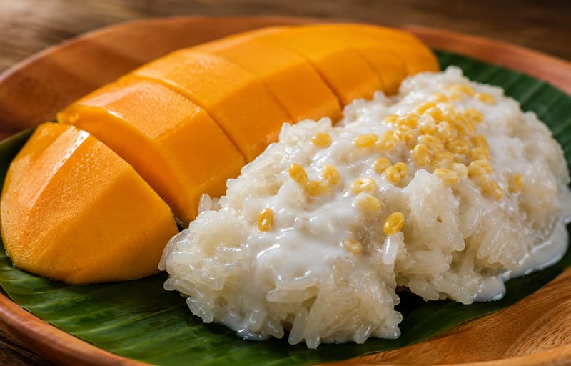 Best mango sticky rice dessert in NYC with ripe mango and coconut sticky rice at Zoob Zib Thai NYC